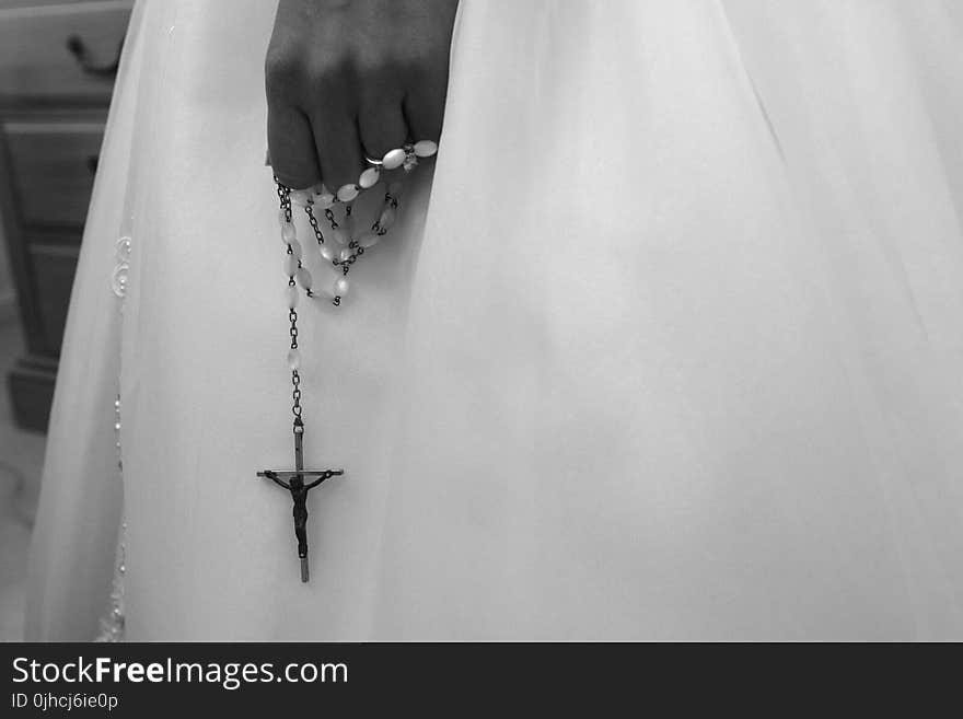 Grayscale Photo Of Person Holding Rosary