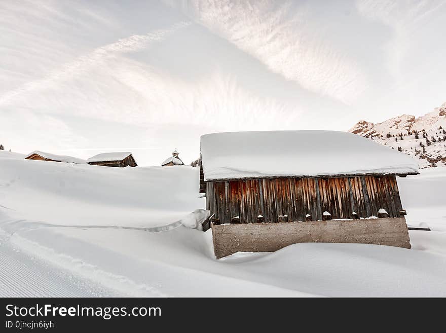 Photo of Concrete Houses Covered With Snow