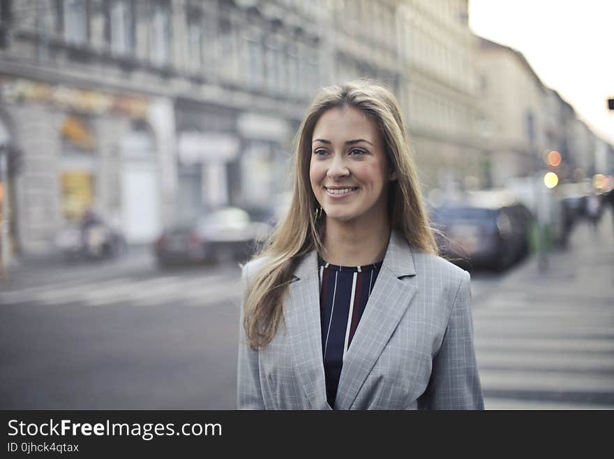 Close-up Photography of a Woman Wearing Formal Coat