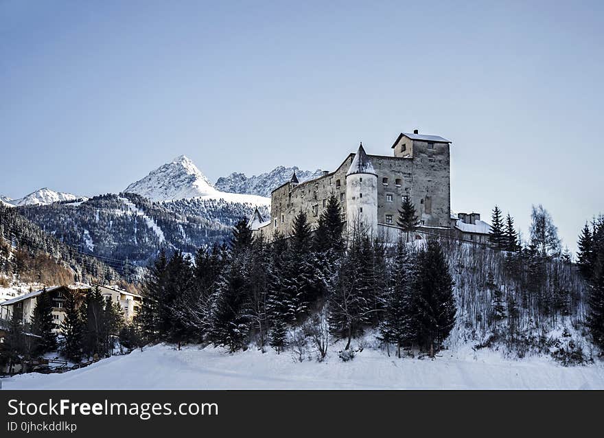 Gray Concrete Building on Snow Field