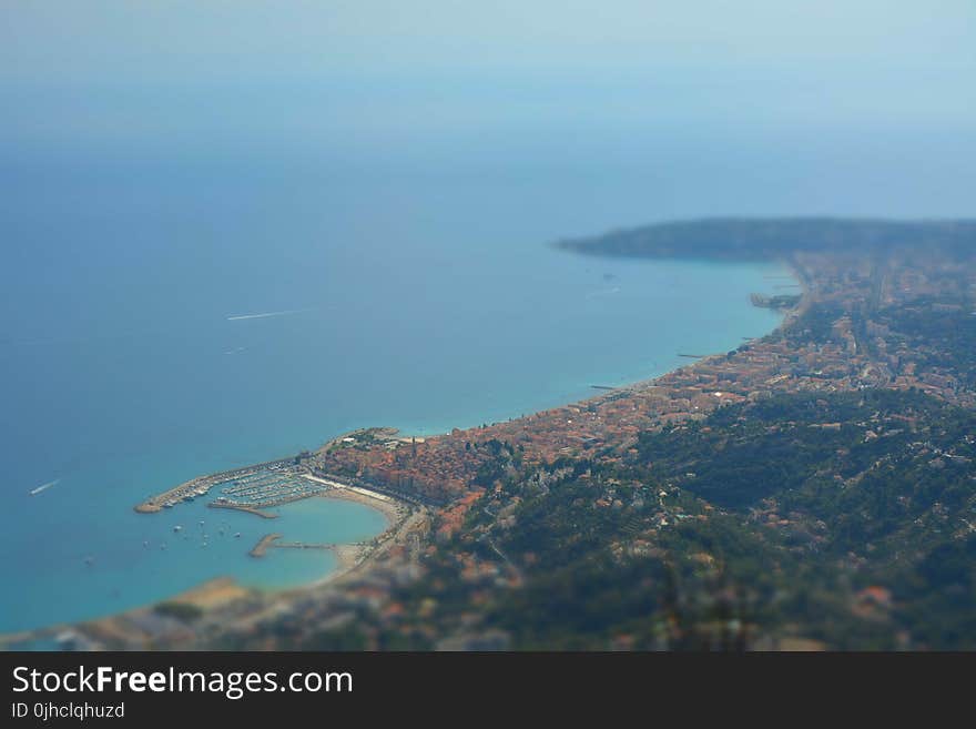 Aerial Photography Of Island Under Blue Sky