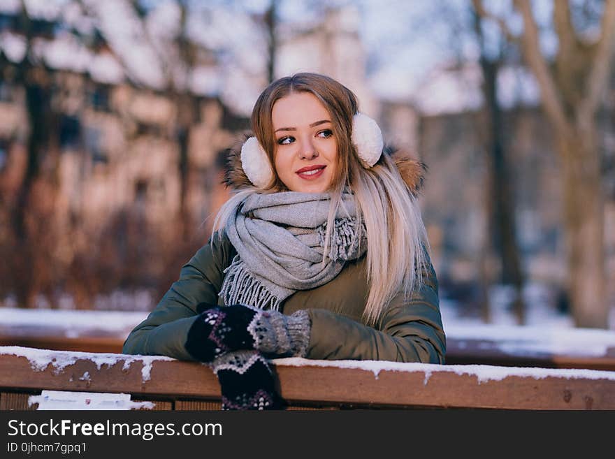 Woman Wearing Jacket Leaned on Wooden Rail