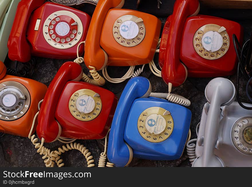 Seven Assorted Colored Rotary Telephones