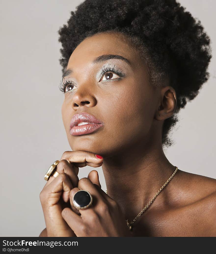 Woman With Gold-colored Accessories Taking Picture Inside Room