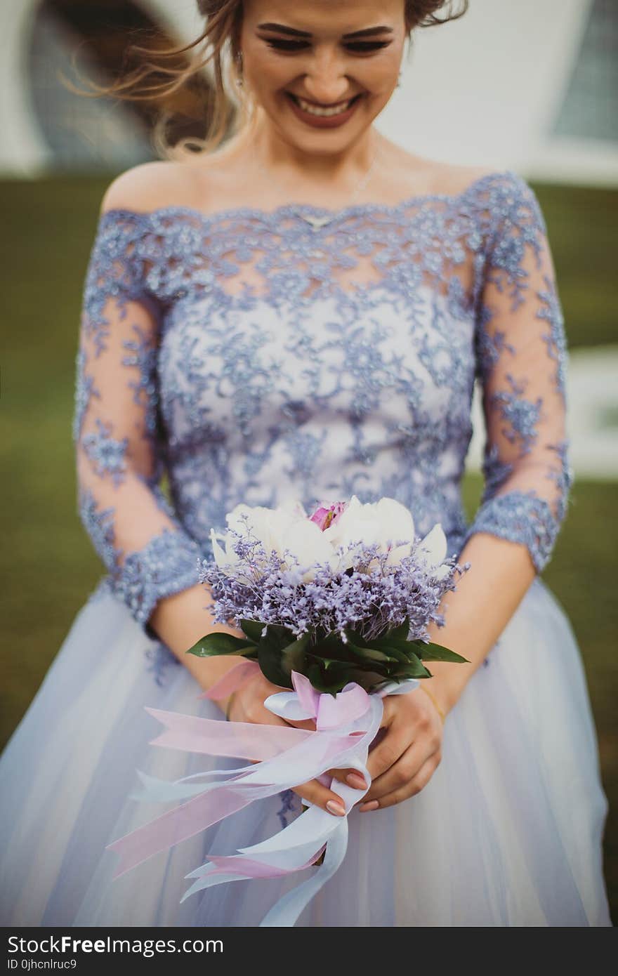 Shallow Focus on Purple Floral Off-shoulder Long-sleeved Lace Wedding Gown