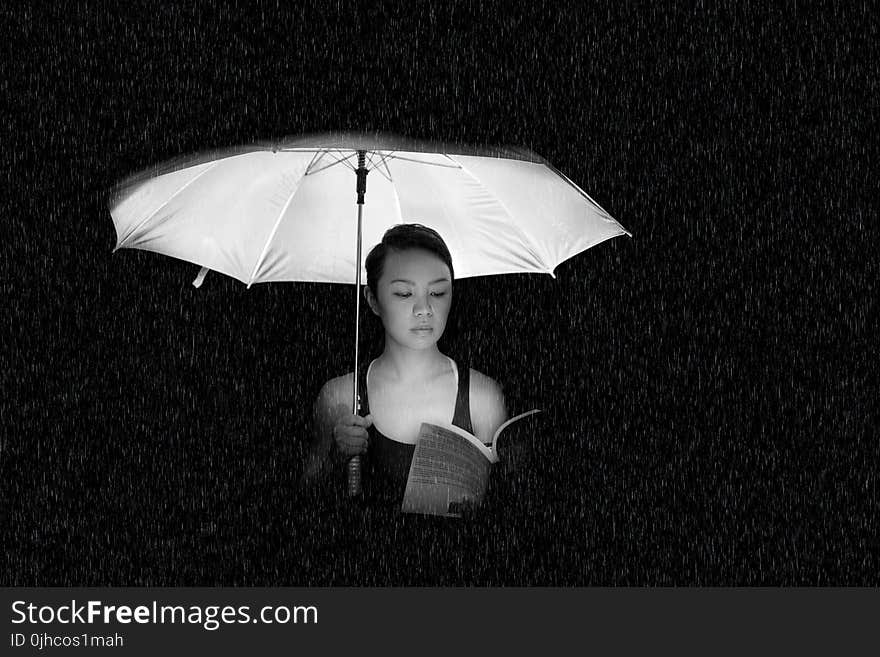 Woman Holding an Umbrella Greyscale Photo