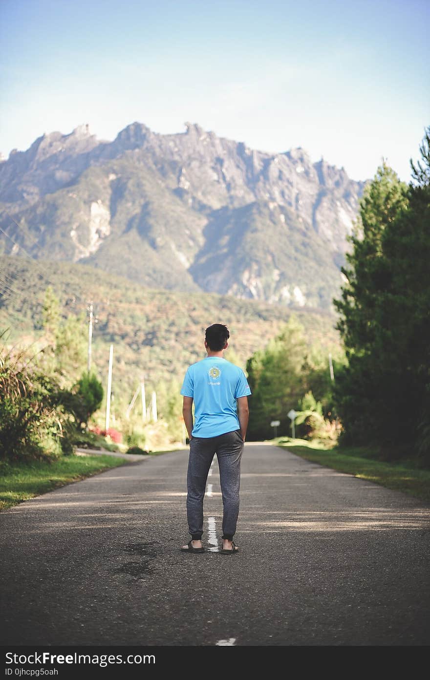 Man Standing on Road