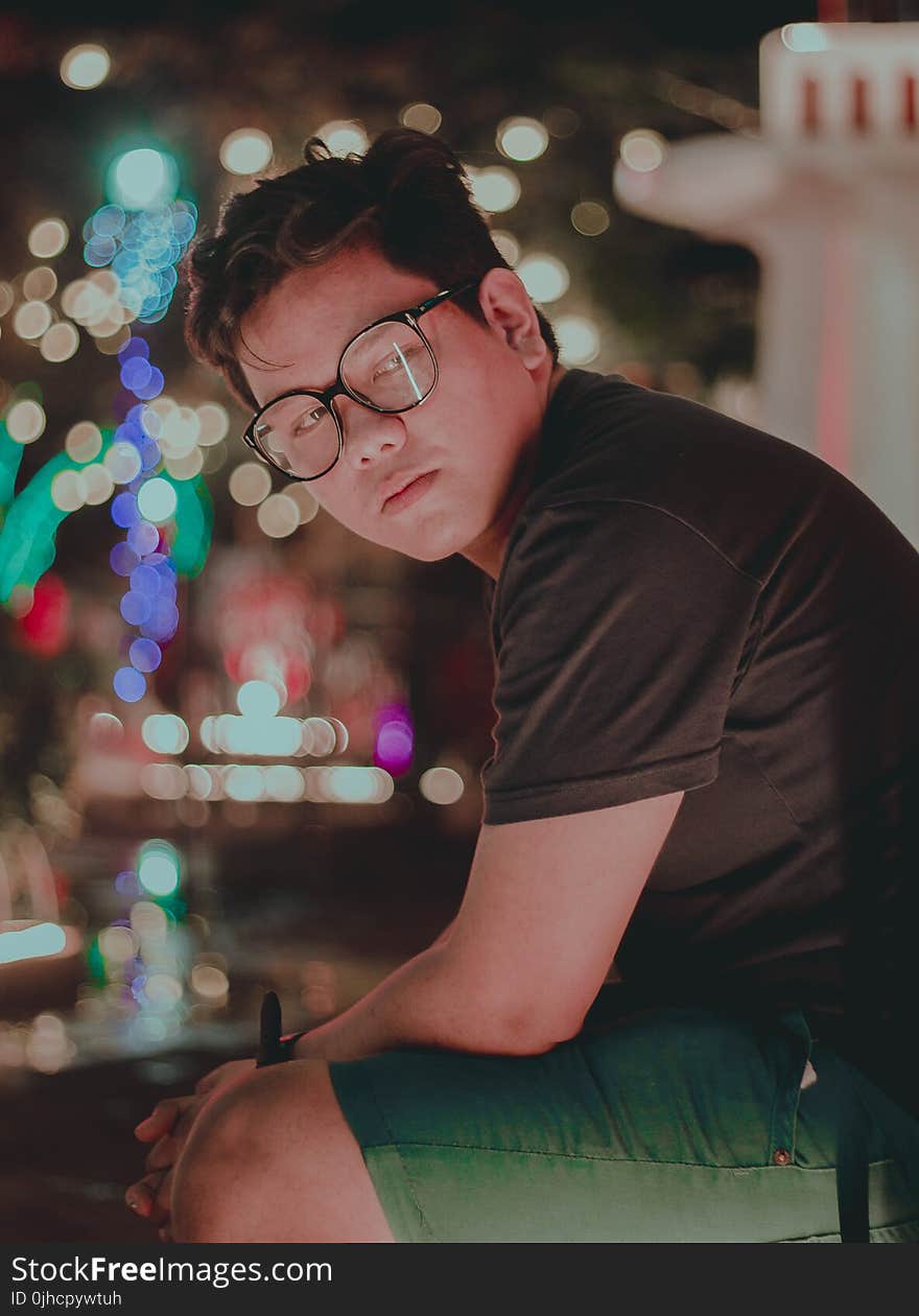 Photography of a Man Wearing Eyeglasses