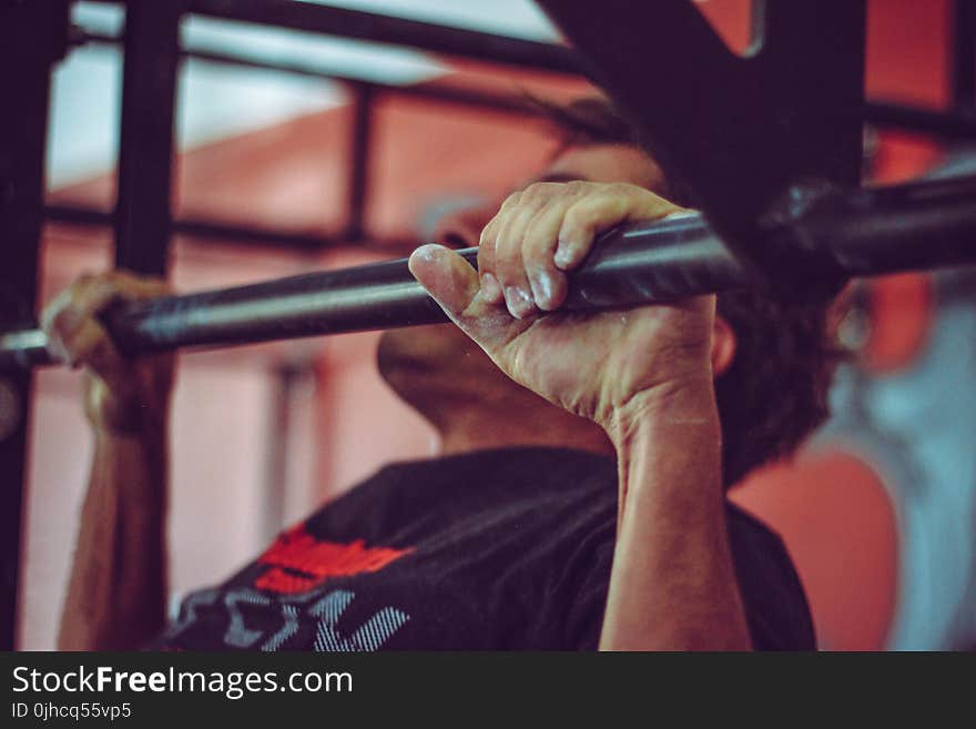 Man In Black Crew-neck Shirt Doing Pull-ups