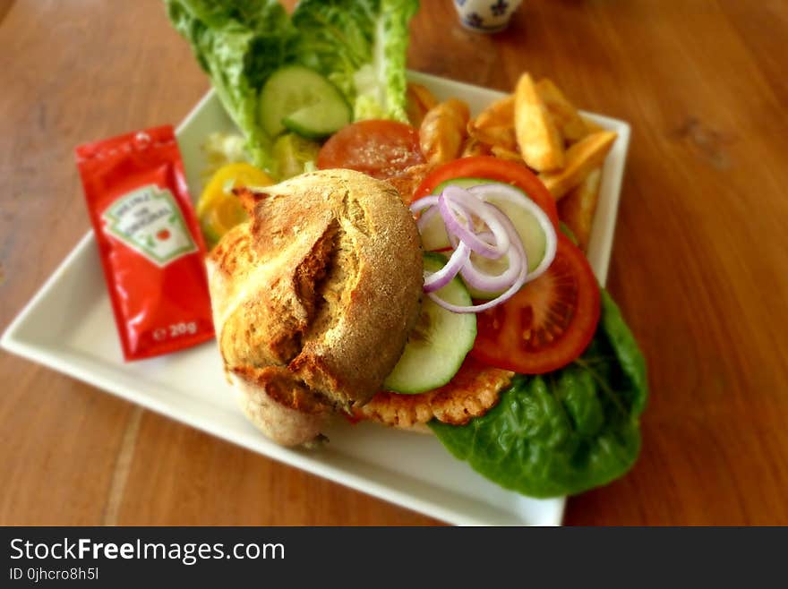 Green Vegetable Salad With Brown Bread on White Ceramic Plate