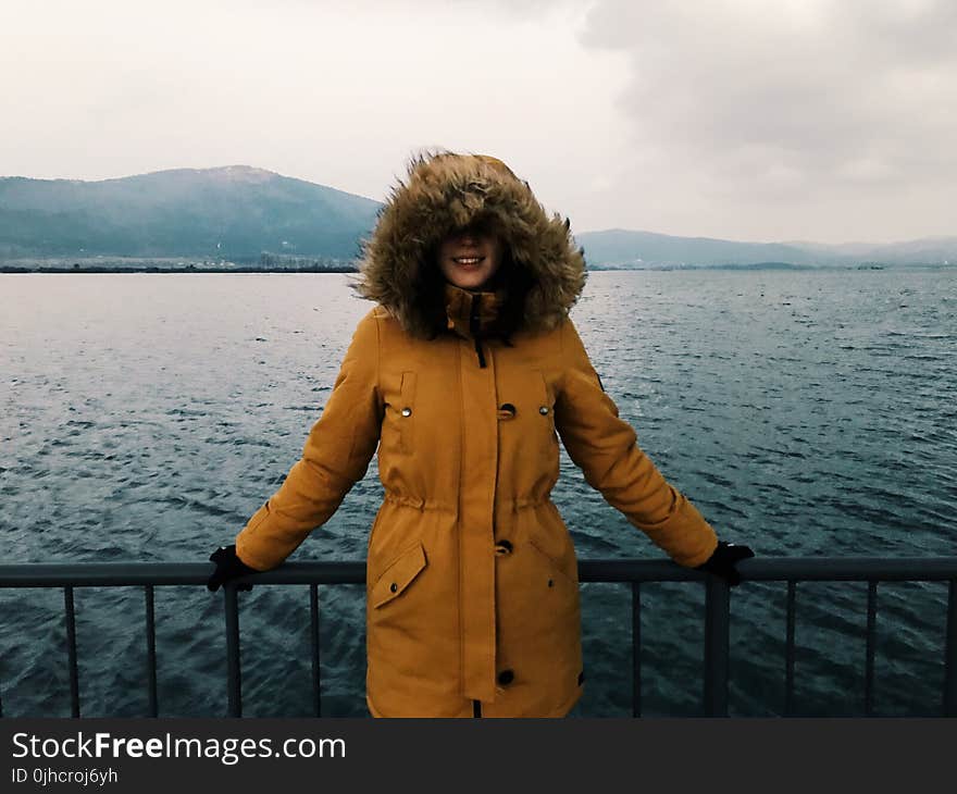 Woman in Yellow Winter Jacket