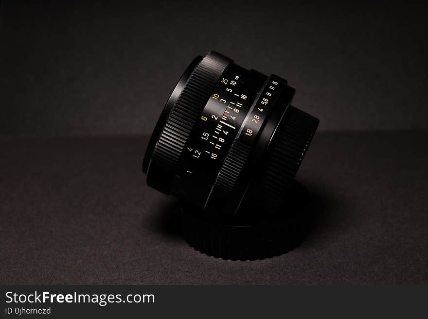 Black Camera Lens on Black Textile