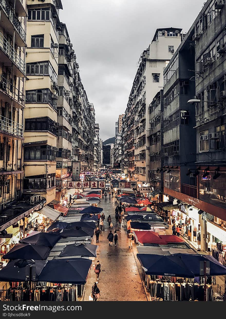 Photo of a Pathway With Gray and Black Buildings