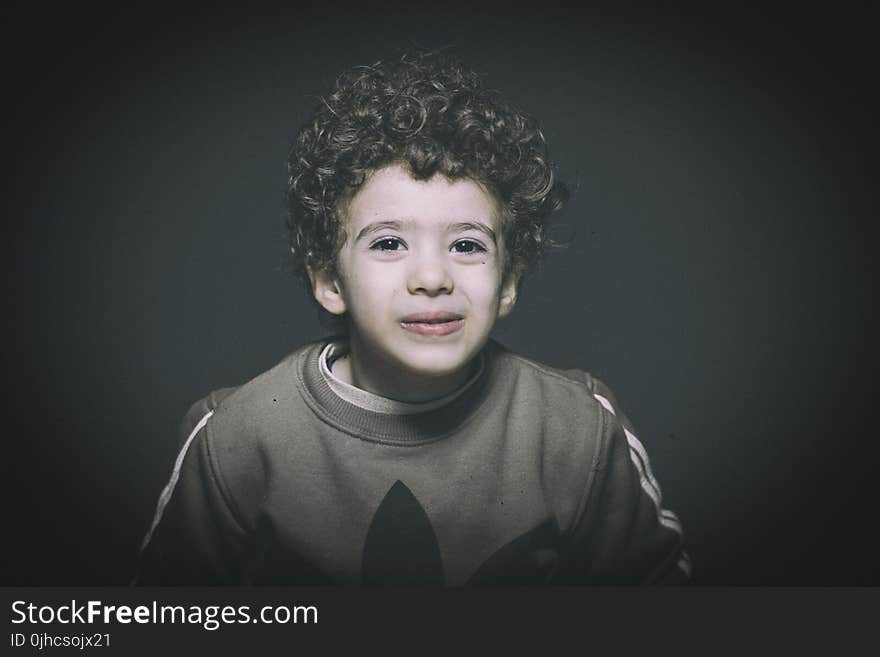 Boy Wearing Brown Sweatshirt