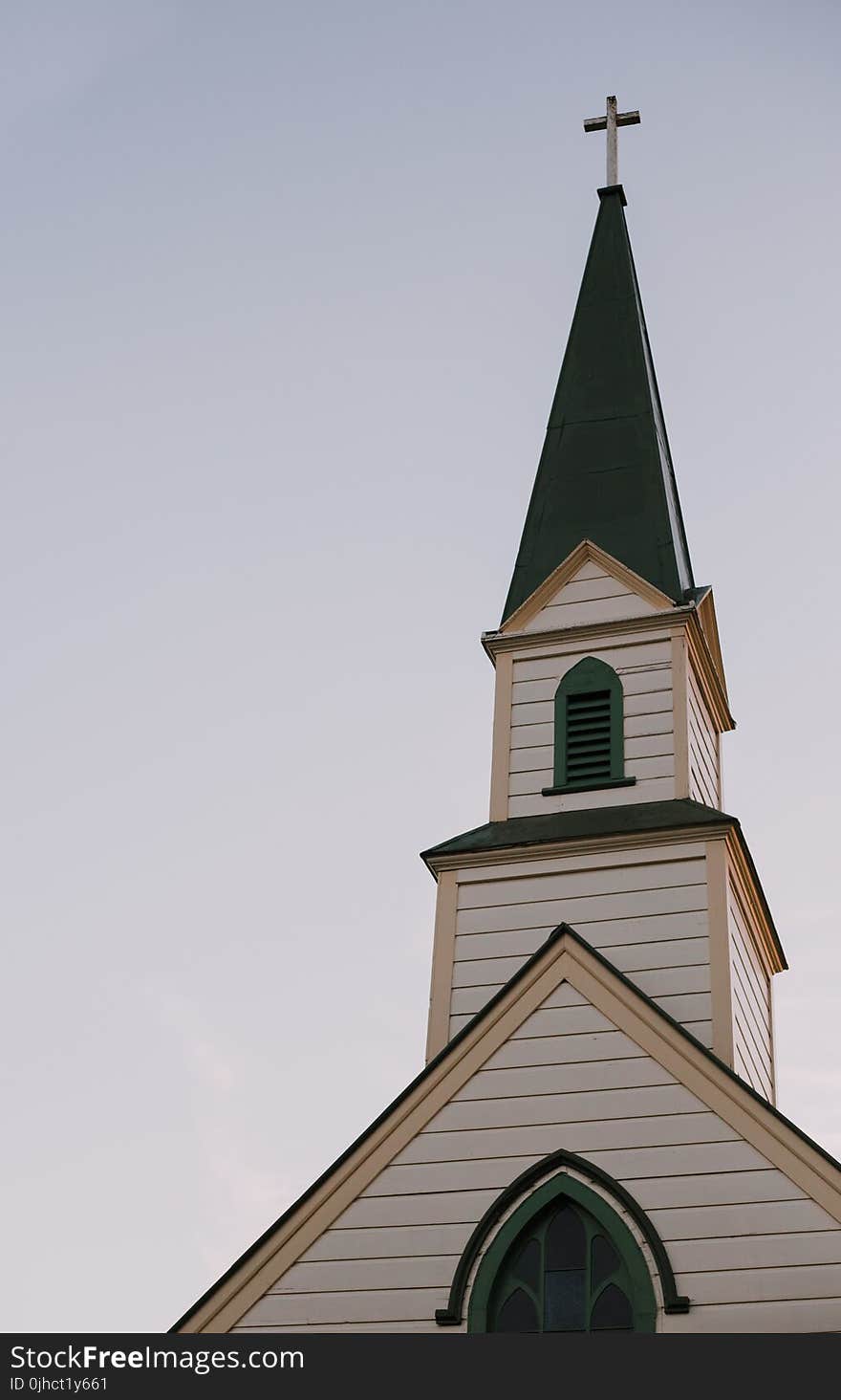 Architectural Photography of White and Green Church Bell Tower Under Clear Sky