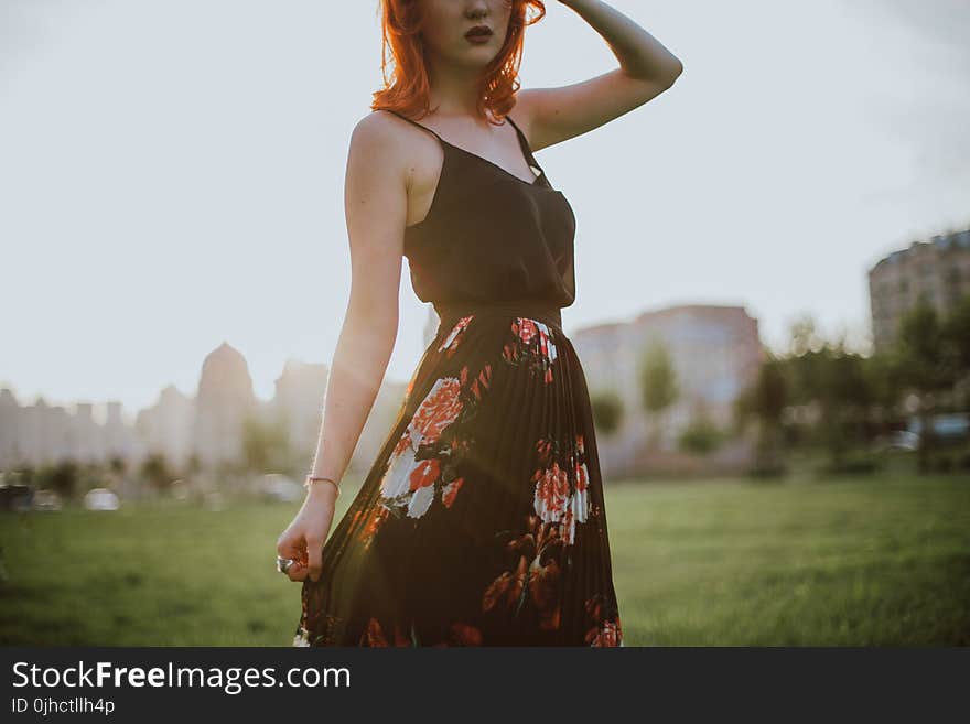 Photography of Woman in Black Spaghetti Strap Dress