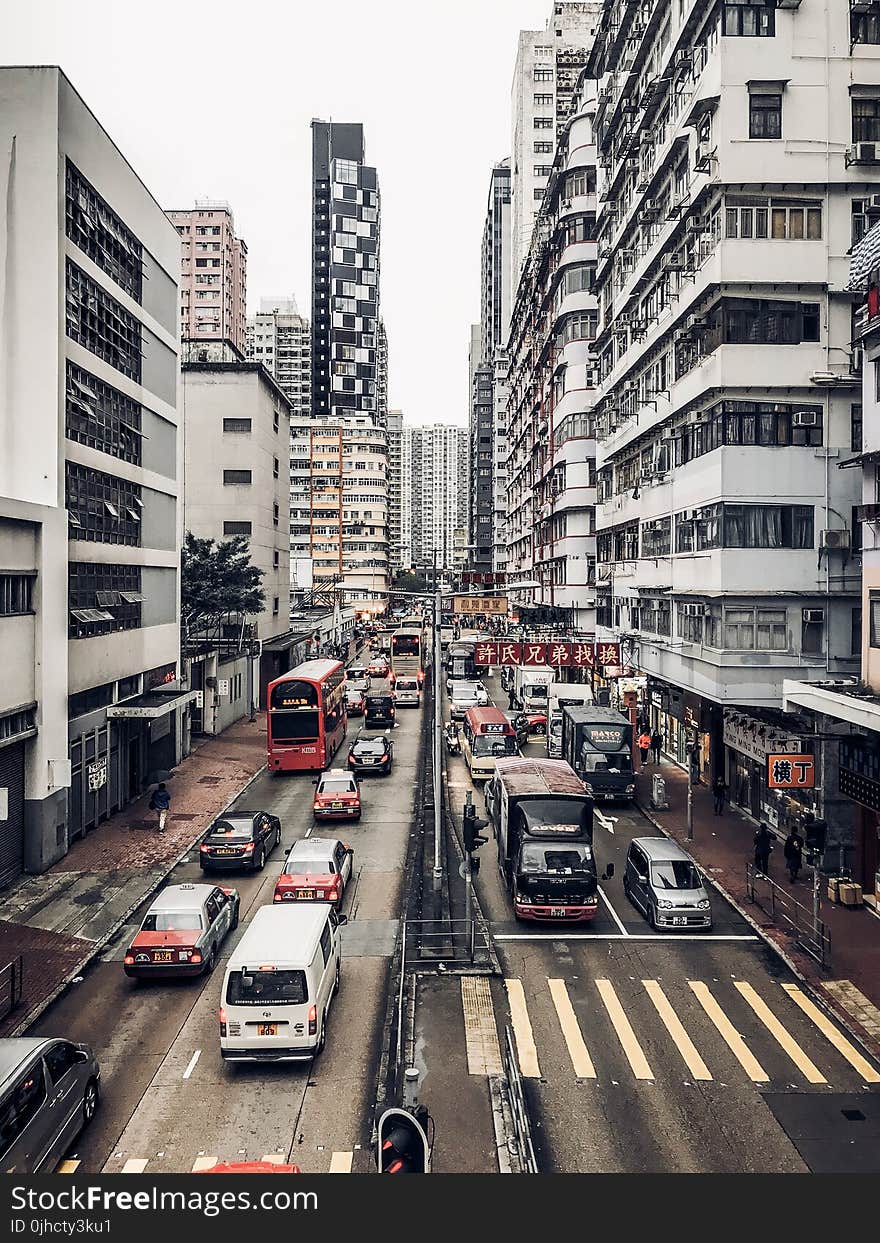 Photography of Buildings and Cars on Road