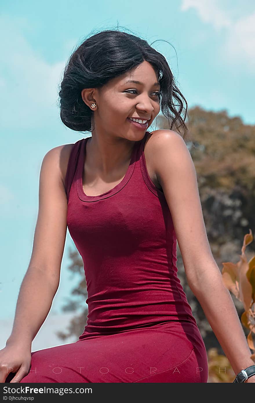 Close Up Photograph of Woman Wearing Red Tank Top