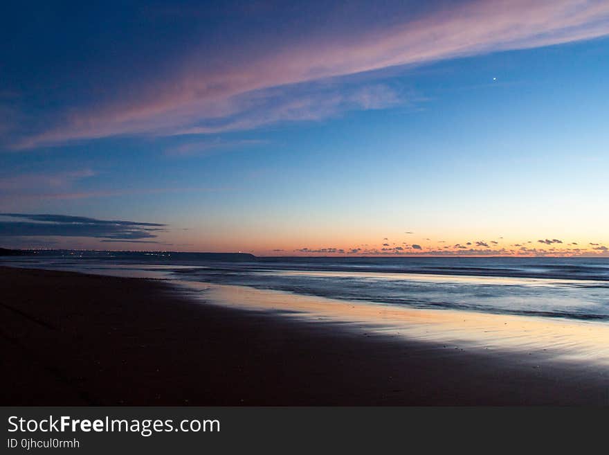 Time Lapse Photo of Seashore during Golden Hour