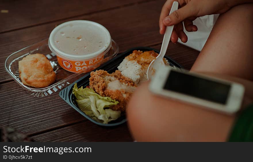 Person Holding White Disposable Spoon Eating Fried Chicken