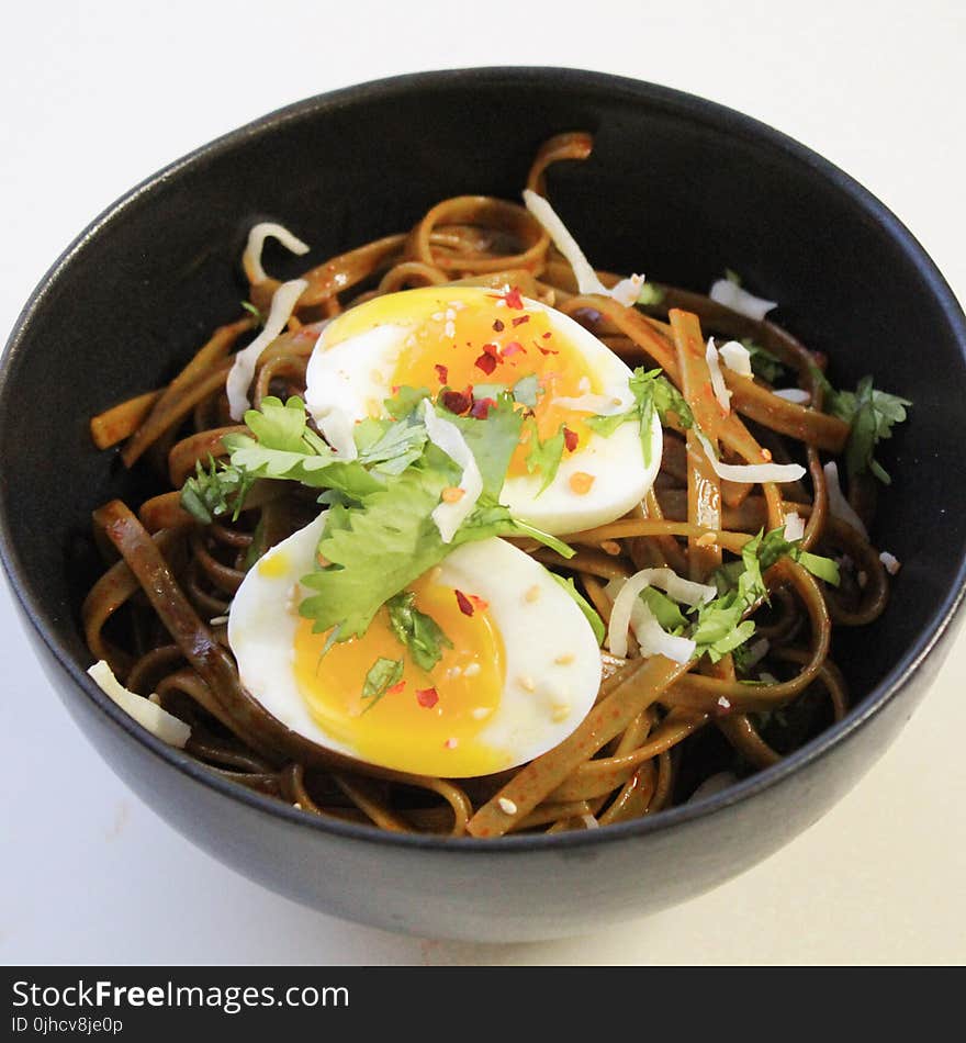 Bowl Filled With Noodles and Hard Boiled Egg