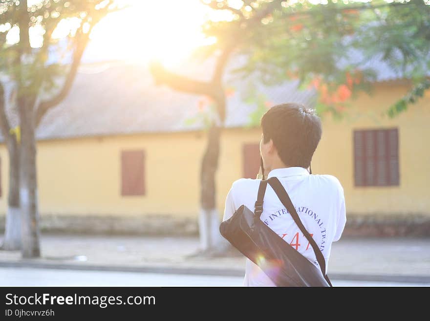 Man Wearing Polo Shirt With Bag