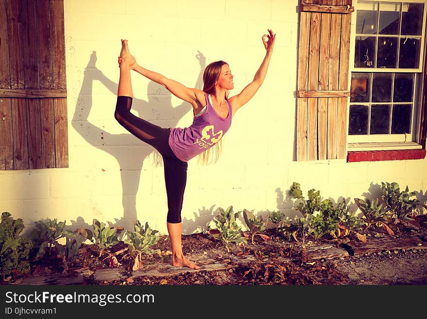 Woman Doing Yoga at Garden