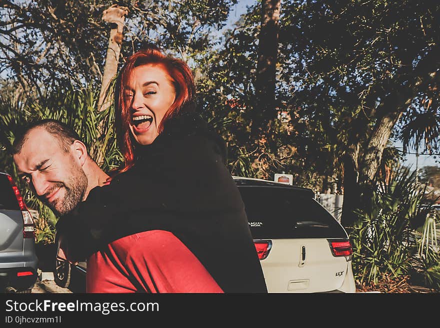 Woman Being Carried by Man Outdoor