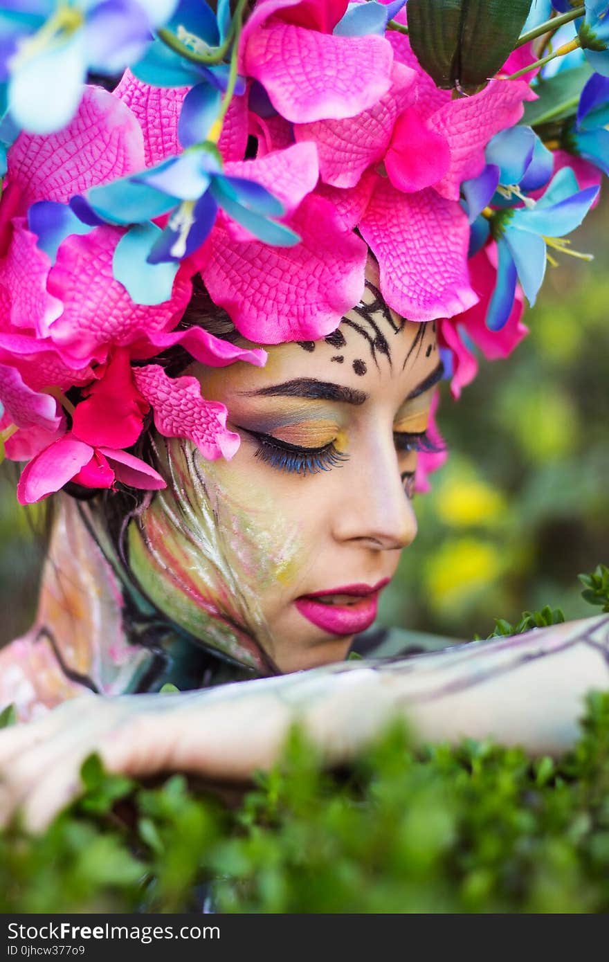 Woman Wearing Pink Petaled Flower Head Dress