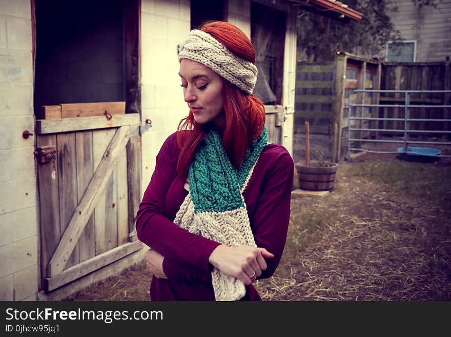 Woman in Purple Sweatshirt Wearing Knitted Beanie and Scarf