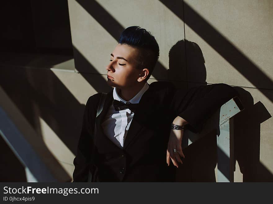 Man in Black Suit Jacket on Stairs