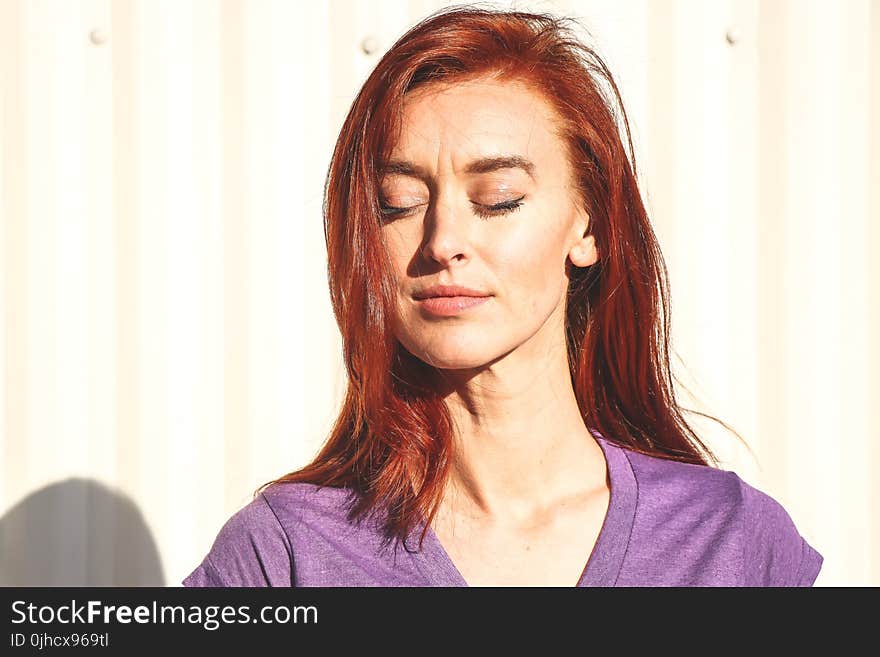 Close Up Photo of Woman Wearing Purple Top