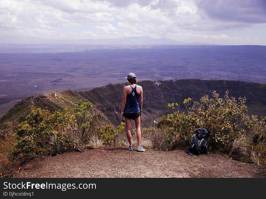 Photography of a Woman Wearing Blue Tank Top