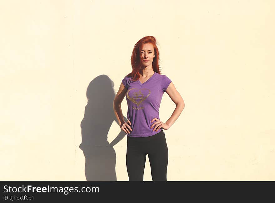 Woman Wearing Purple Shirt and Black Pants