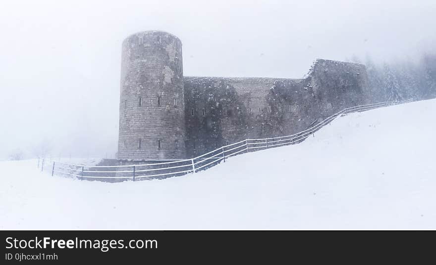 Gray Castle on Snowy Place