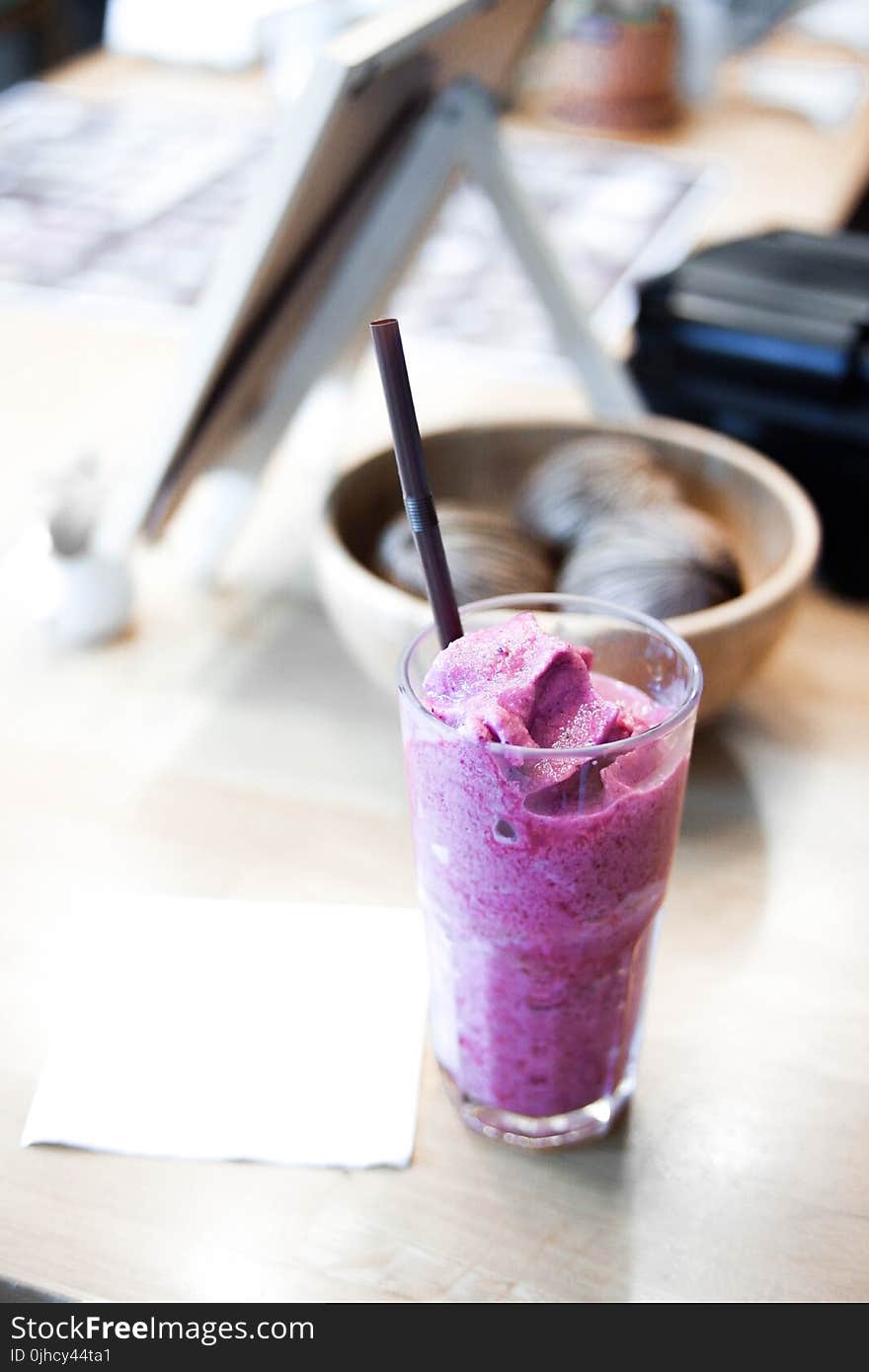 Ice Cream in Drinking Glass With Brow Straw