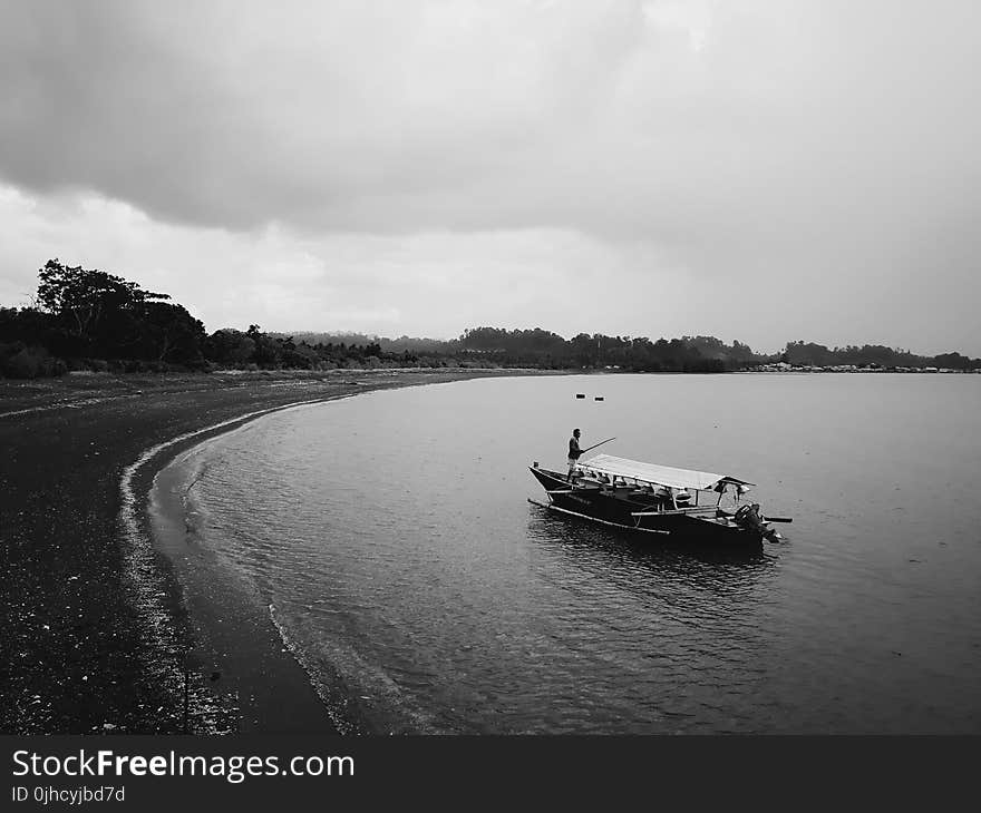 Grayscale Photo of Row Boat