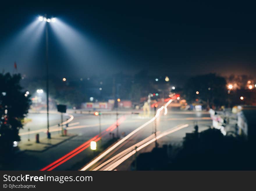 Time Lapse Photo of Road With Red and Yellow Lights