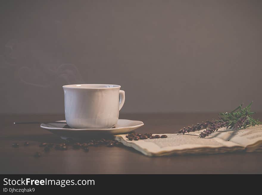 White Ceramic Teacup With Saucer