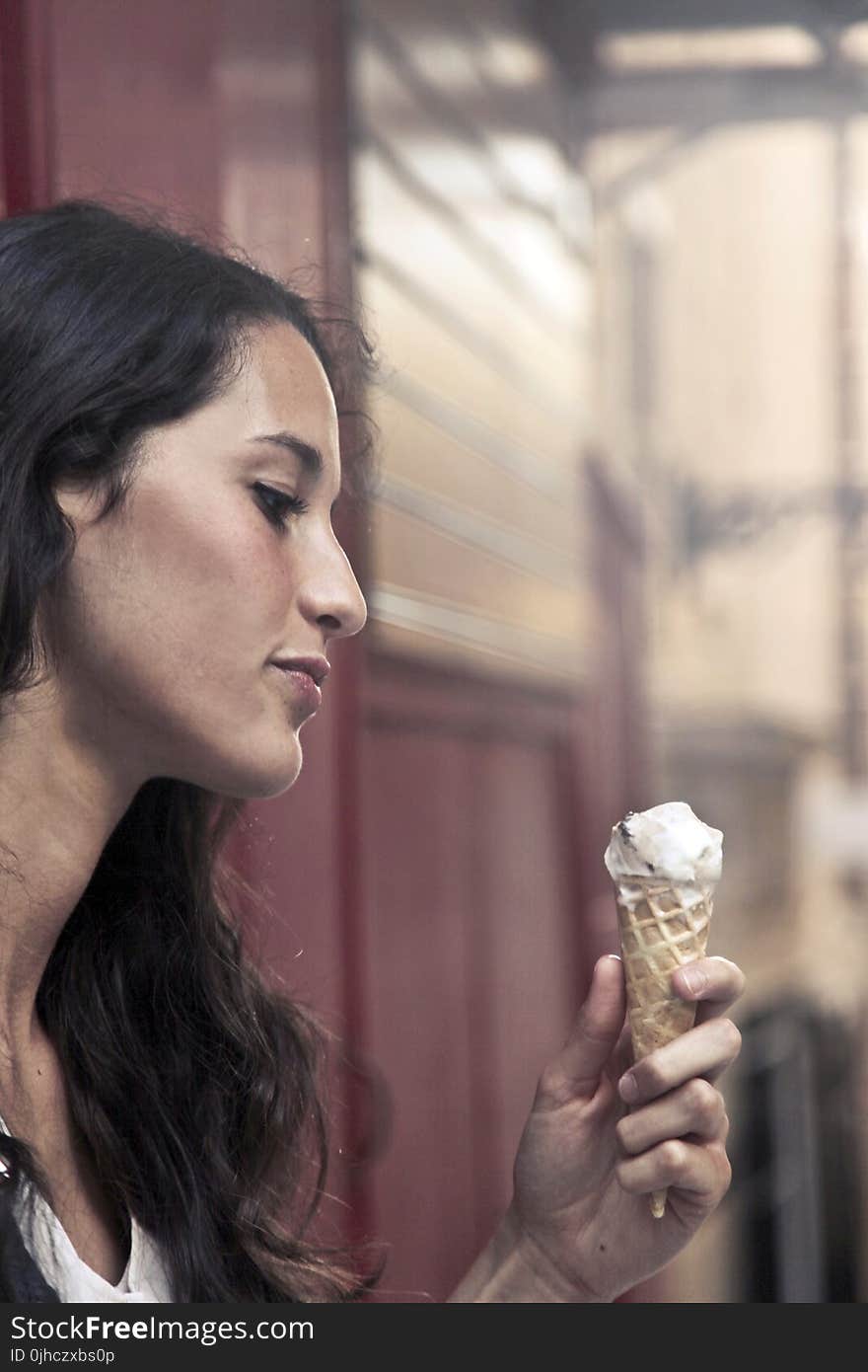 Photography of a Woman Holding Ice Cream