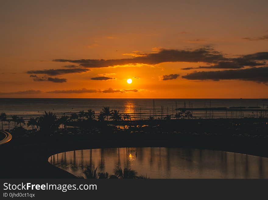 Silhouette of Beach With Background of Sunset