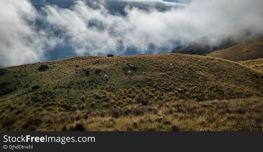 Green Hill Covered by Clouds