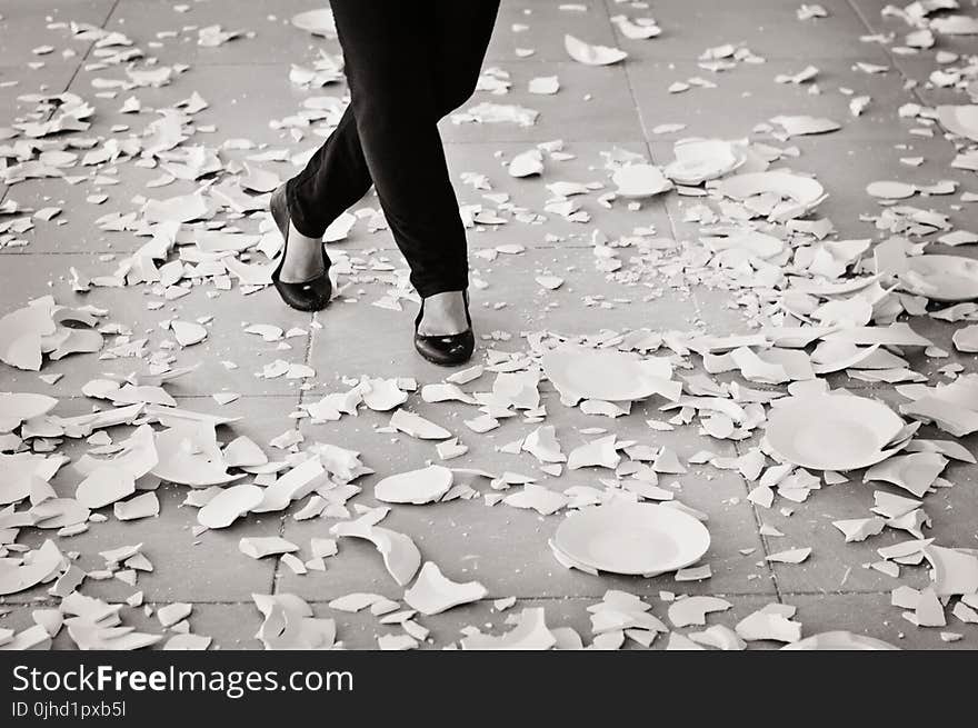 Grayscale of Woman in Black Flat Sandals Walking