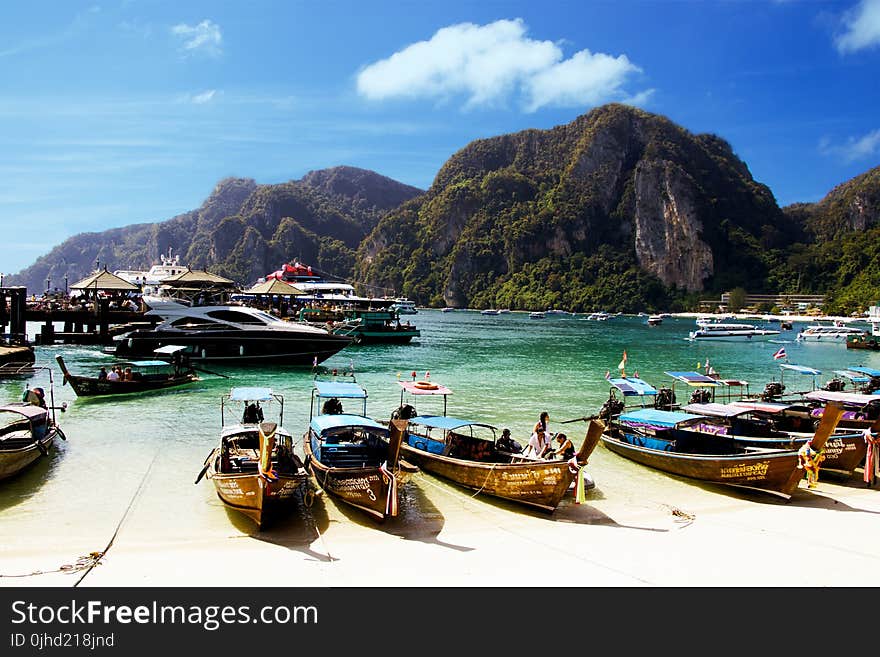 Yellow Wooden Boat Dock on White Sand Beach