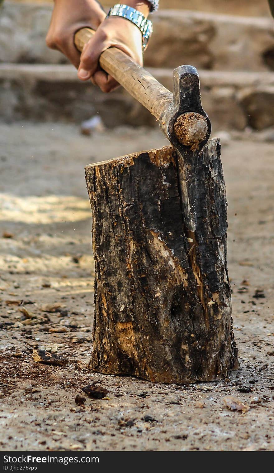 Photography of a Person Chopping Wood