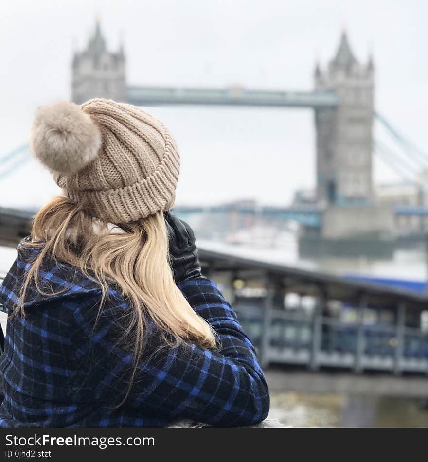 Woman Wearing Brown Beanie Holding Smartphone