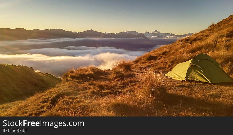 Green Tent On Top Of Mountain