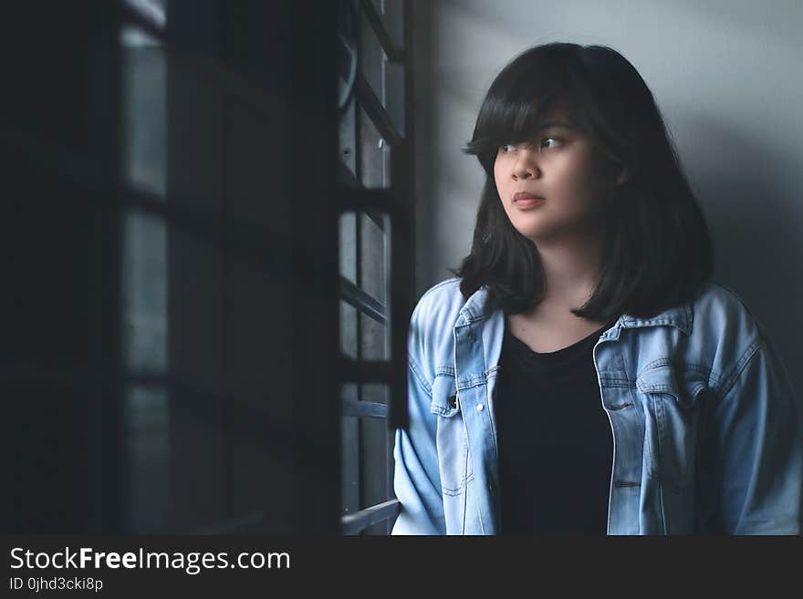 Woman in Blue Denim Jacket Indoors