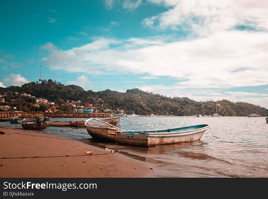 Boats On Seashore During Daytime