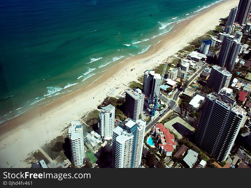 Aerial Photo Of Buildings Near Body Of Water